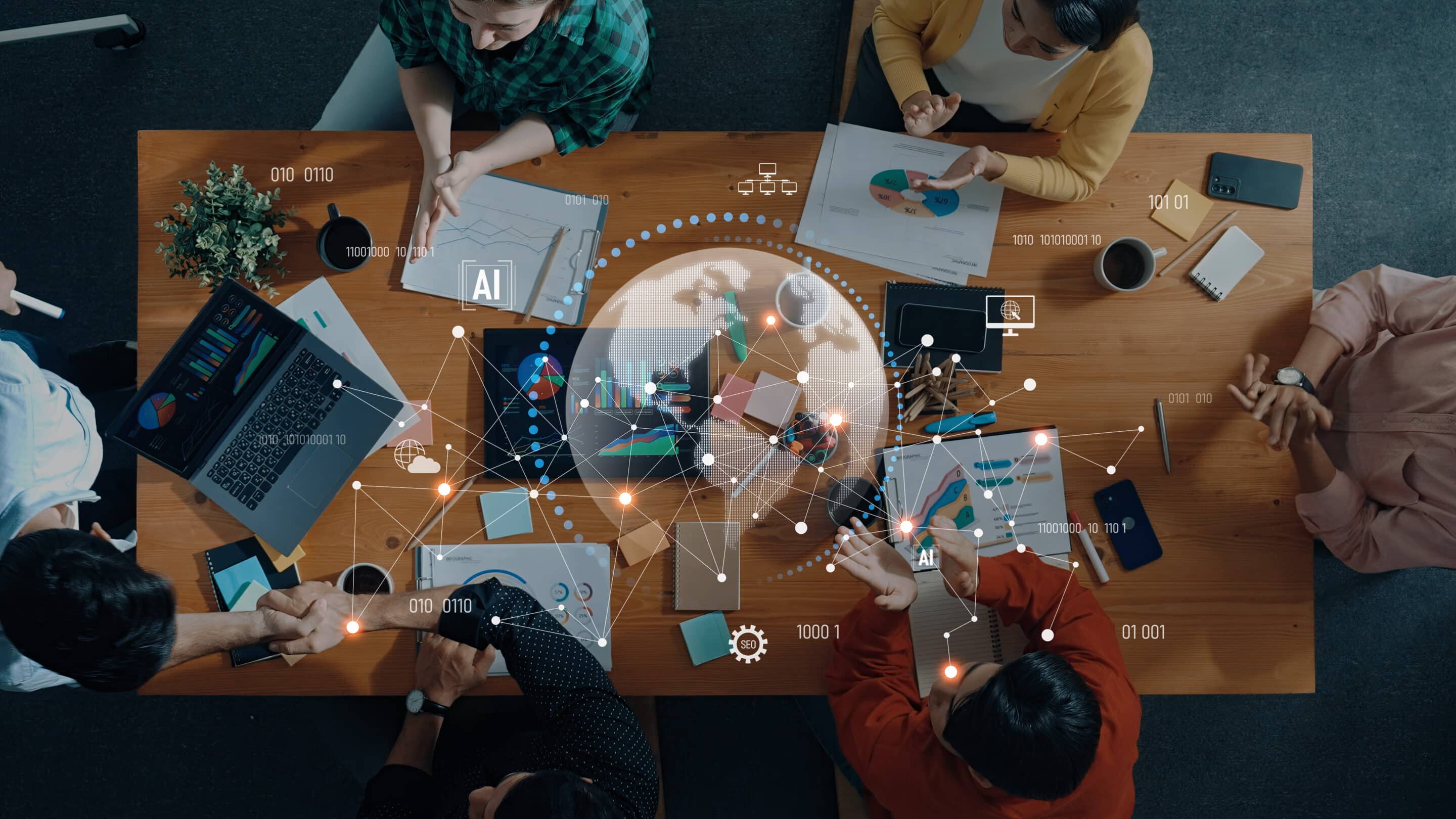 Business Team Collaborating on Data Analysis and Artificial Intelligence Strategies in Modern Office Environment During Meeting Trope Team collaborates around a wood table with laptops and printed charts, overlaid with AI data graphics.